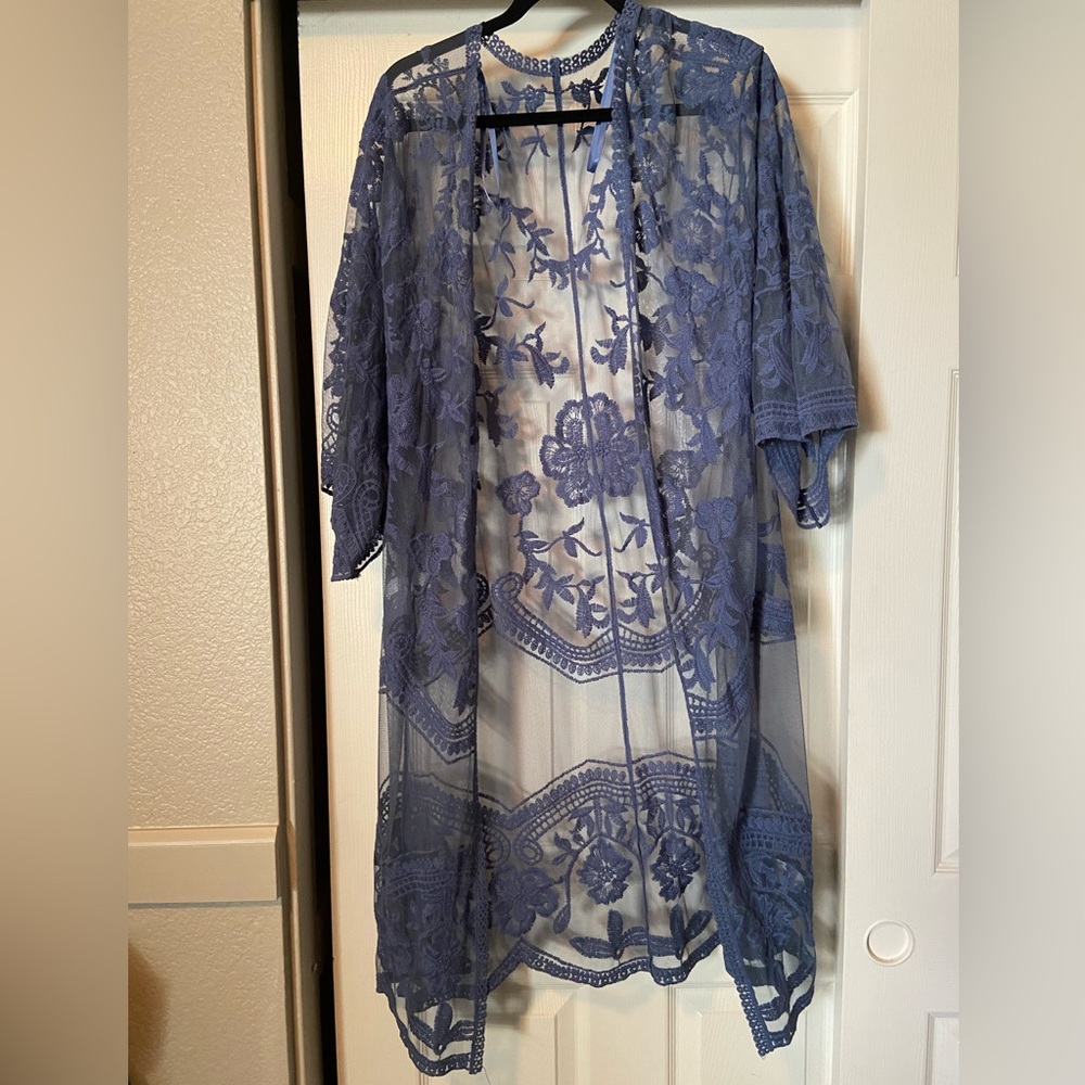 Sheer blue lace kimono. Worn once, no tears or damage to lace. One size.